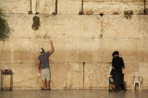 Jewish people praying to the Jerusalem's western wall, the wailing wall